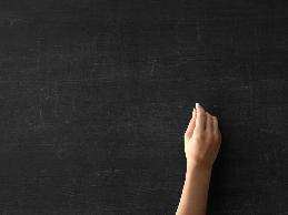 A teacher with cerebral palsy had difficulty manipulating papers and writing on the chalkboard.