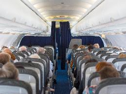 A salesman with obesity had to travel by airplane once a year to attend a conference, but could not fit in a single, economy class seat.